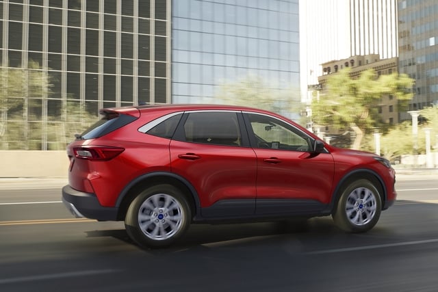2023 Ford Escape® in Rapid Red being driven down a city road