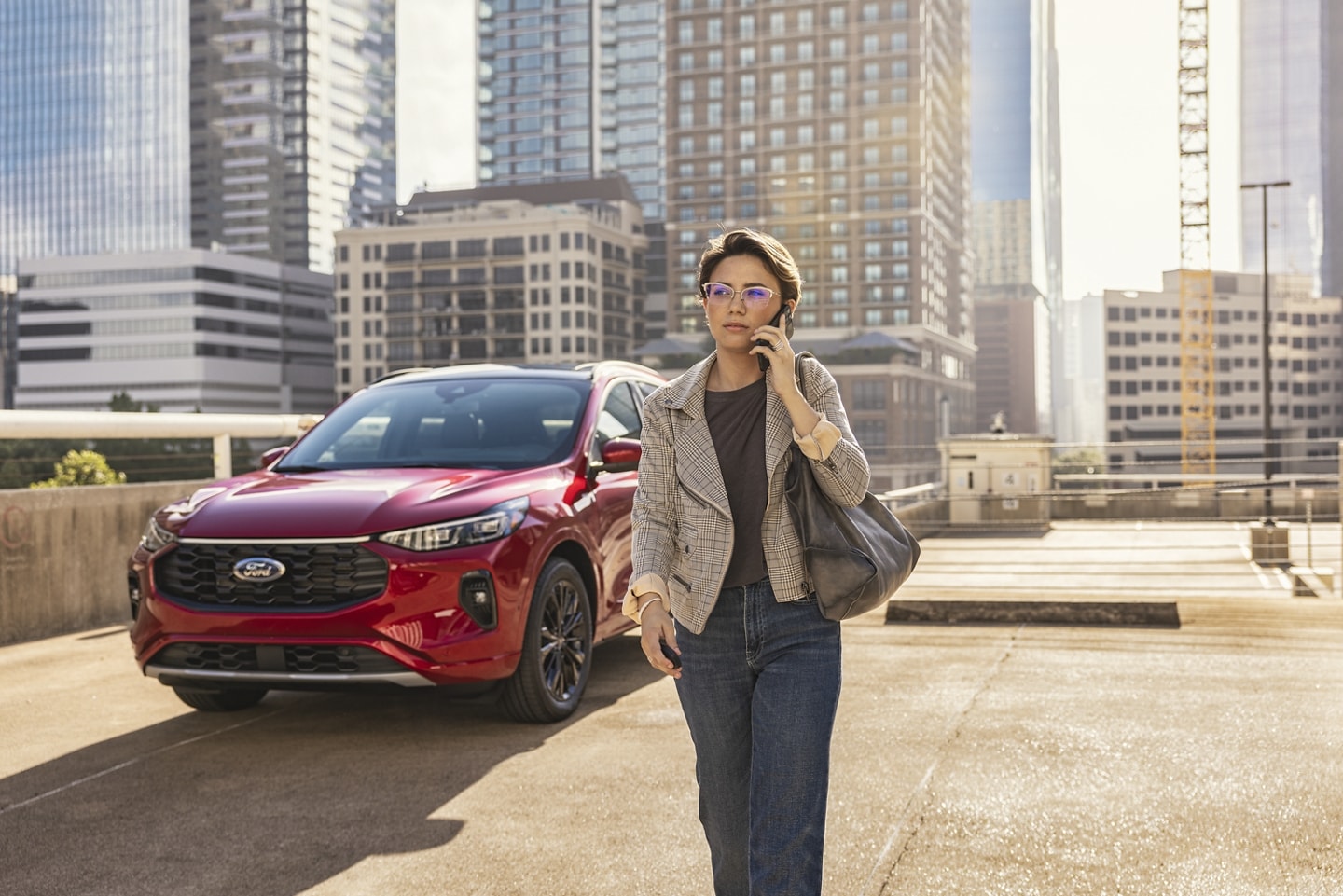 Woman making a call to schedule her Ford service