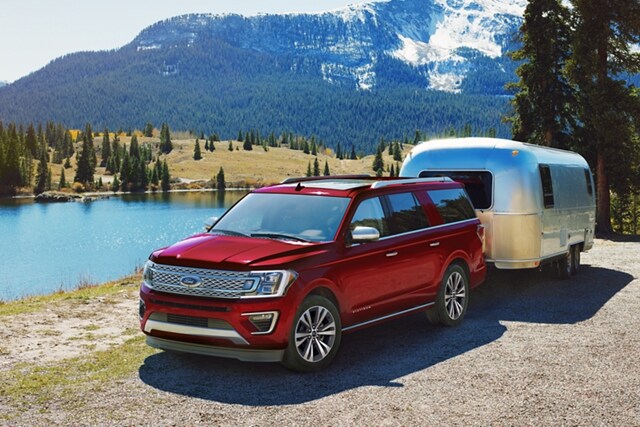 2021 Ford Expedition with available Panoramic vista roof towing a trailer