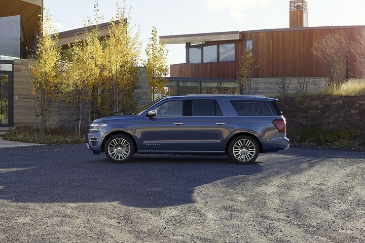 A 2023 Ford Expedition SUV parked in front of a house