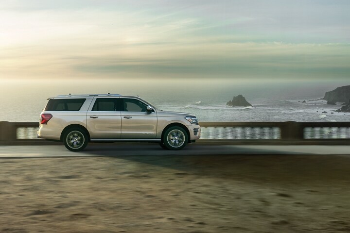 A 2023 Ford Expedition SUV being driven next to a body of water