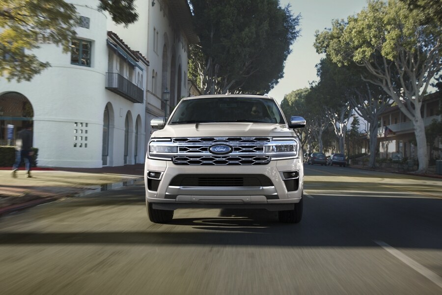 A 2023 Ford Expedition Platinum being driven on scenic street