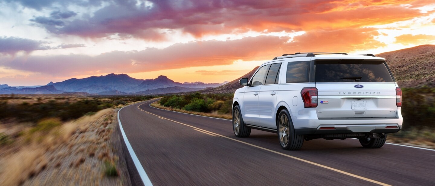 A 2023 Ford Expedition SUV being driven along a mountain road