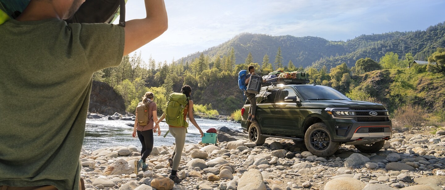 A 2023 Ford Expedition SUV Timberline parked next to a river