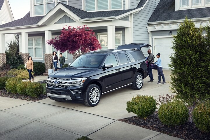 A family loads gear into a 2023 Ford Expedition Truck