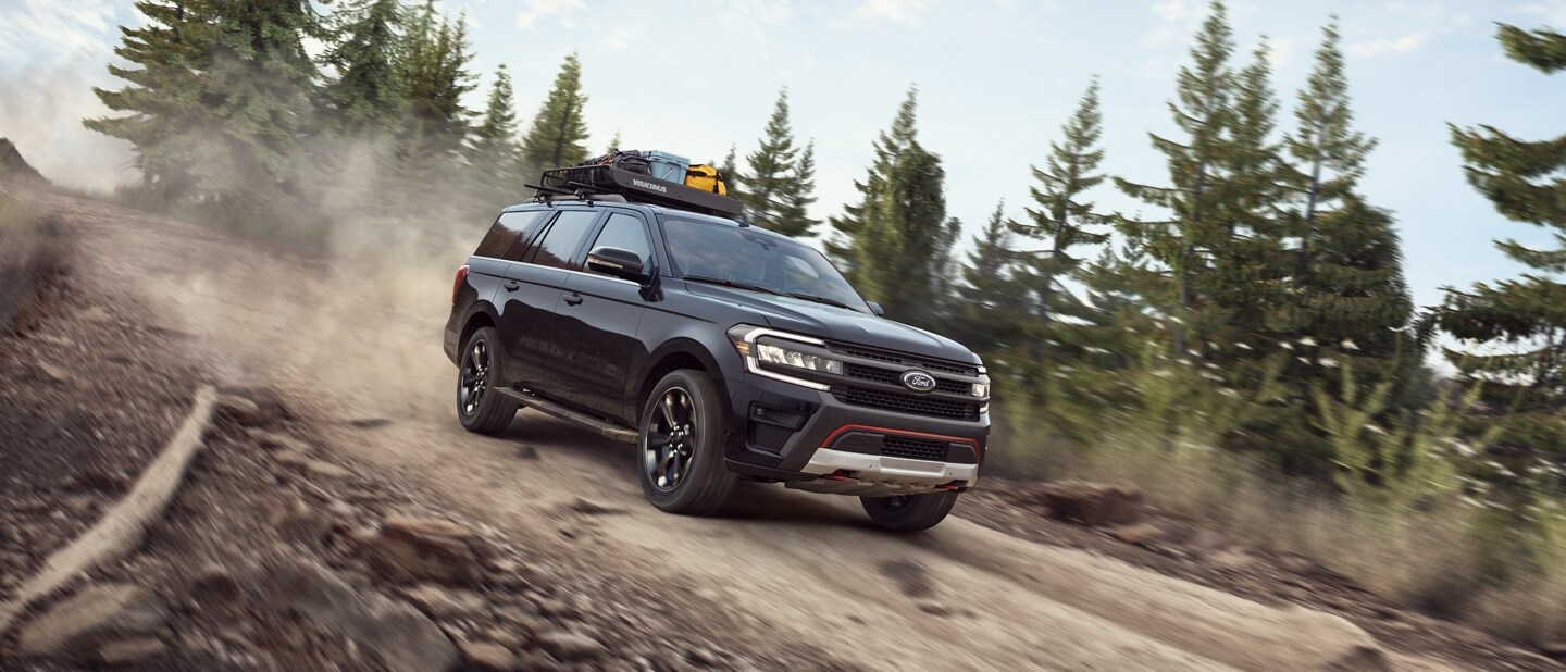A 2023 Ford Expedition SUV being driven down a steep road