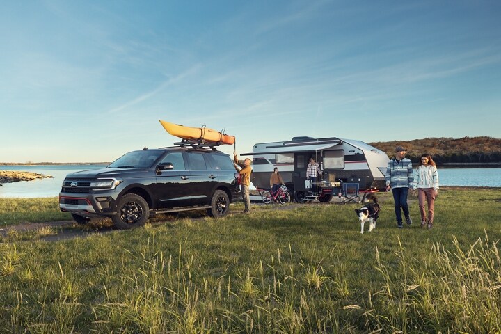 A 2023 Ford Expedition SUV parked at a campsite
