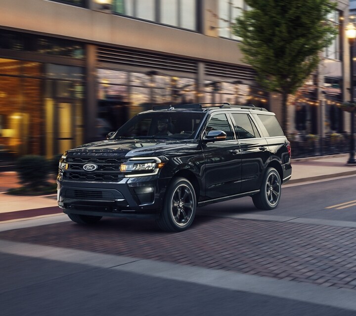A 2023 Ford Expedition SUV being driven down an urban road