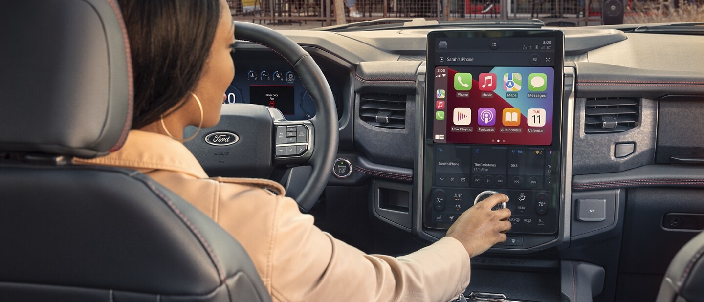 A woman driving a 2023 Ford Expedition SUV