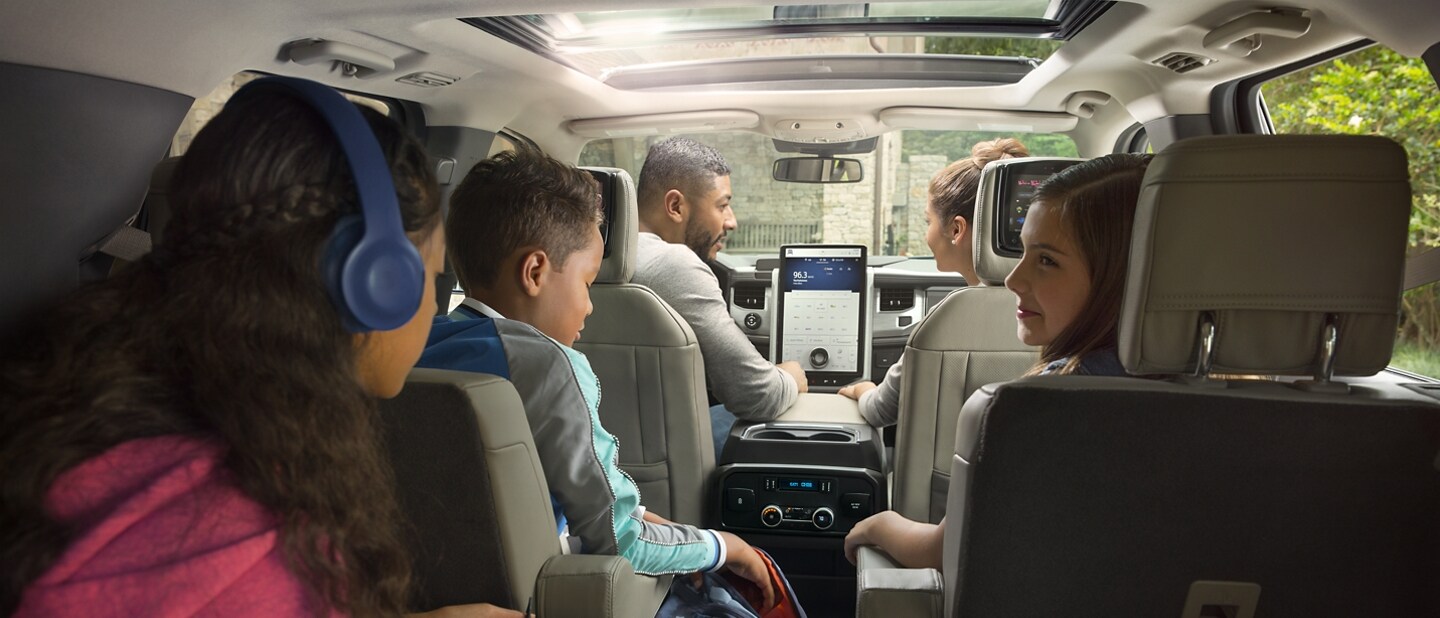 A family of five sitting in a 2023 Ford Expedition SUV