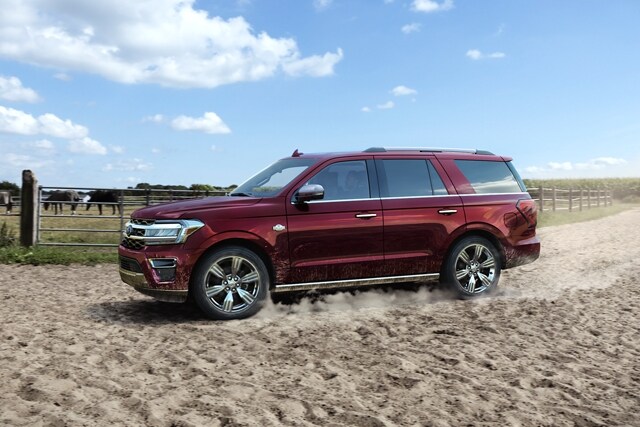 A 2024 Ford Expedition on a sandy, dusty ranch off-road trail