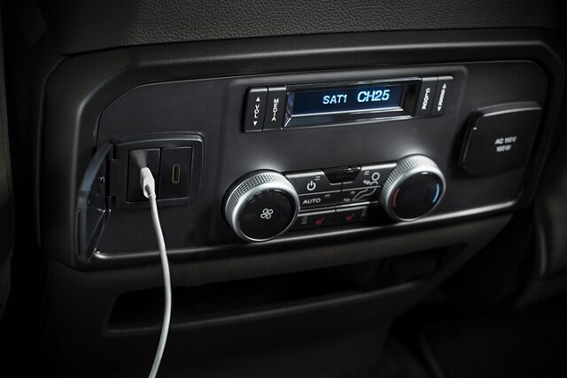 2024 Ford Expedition SUV featuring center console wireless charger with USB ports