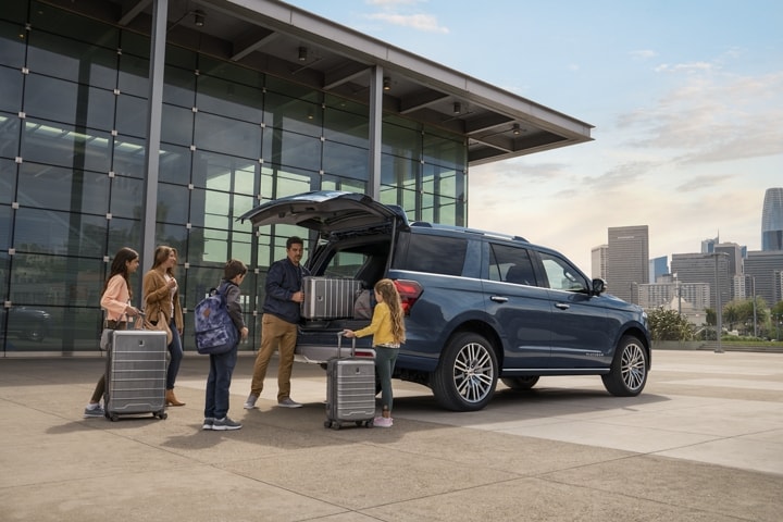 A family loads up a 2024 Ford Expedition with luggage