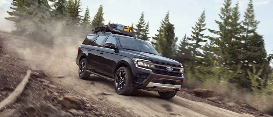 A 2024 Ford Expedition SUV being driven down a steep road