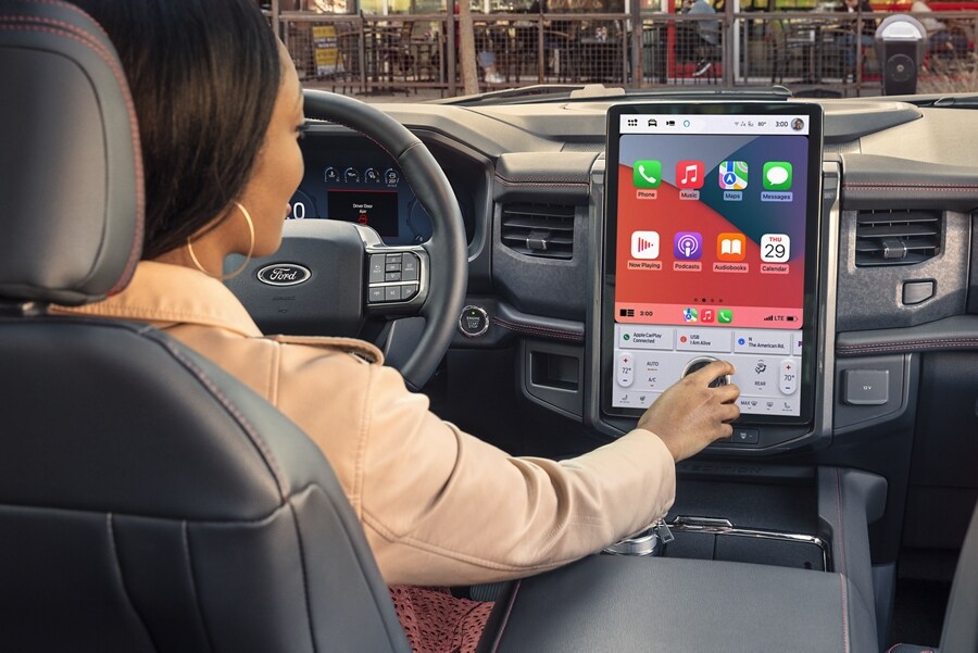 A woman driving a 2024 Ford Expedition SUV
