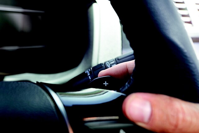 Driver using paddle shifters in a 2023 Ford Explorer® SUV