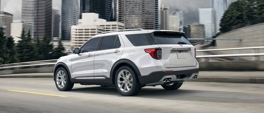 2023 White Ford Explorer driving on highway