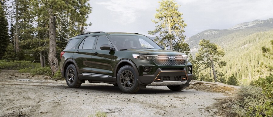 2023 Ford Explorer® Timberline® SUV parked atop a wooded hill