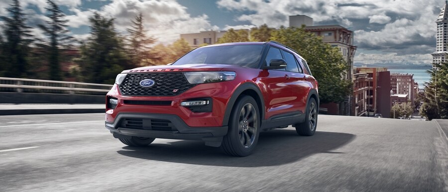 2023 Ford Explorer® ST model being driven away from a town