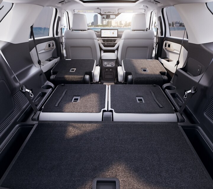  2025 Ford Explorer interior cabin with seats folded down. 