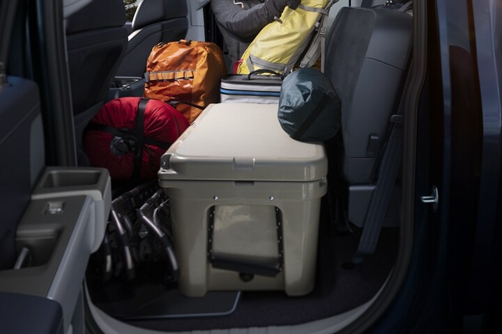 Camping gear on the rear flat load floor in a 2023 Ford F-150®
