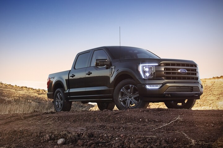 A 2023 Ford F-150® LARIAT Sport parked on a hill