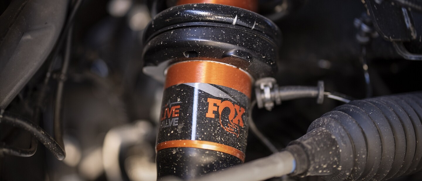 Close-up of the live valve fox racing shox on a 2023 Ford F-150® Raptor®