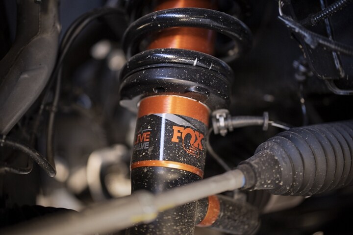 Close-up of the next gen live valve fox racing shox in a 2023 Ford F-150® Raptor®