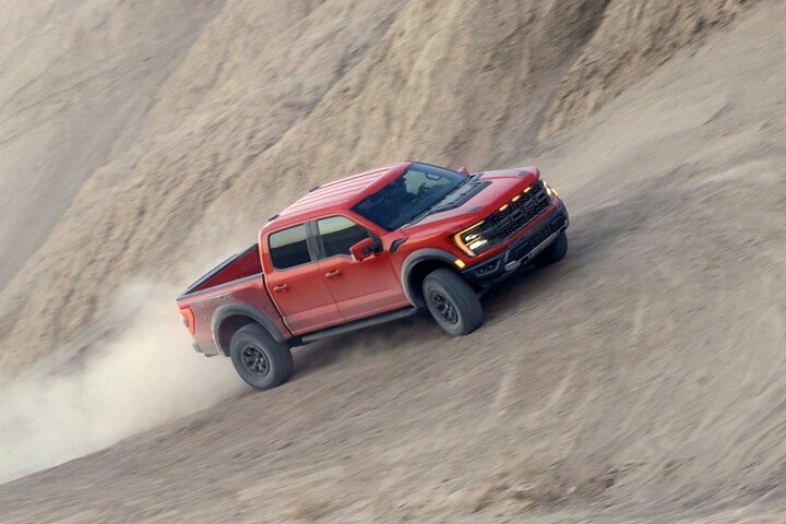 A 2023 Ford F-150® Raptor® being driven off-road in the desert
