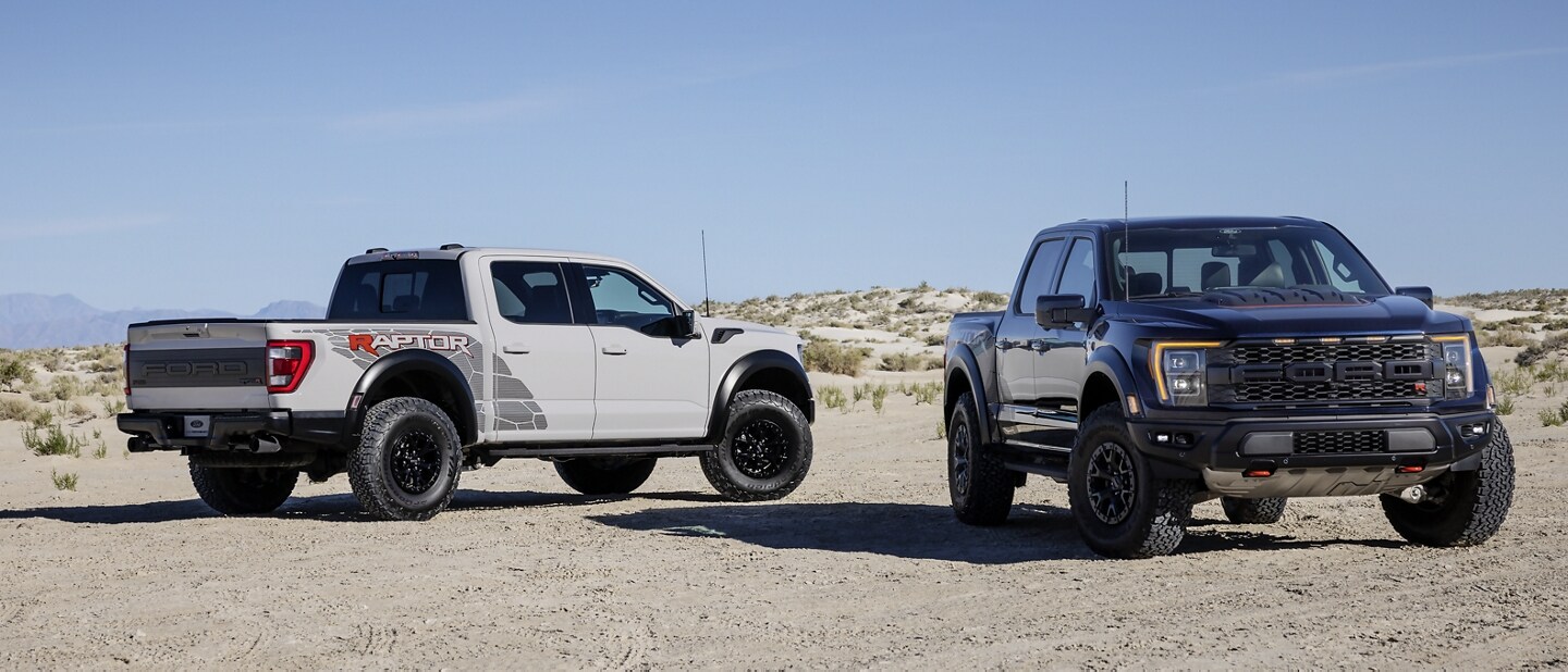 2023 Ford F-150® Raptor® and Raptor R™ trucks parked in the desert