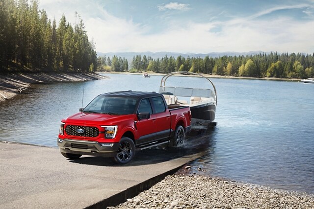 Image of a 2023 Ford F-150® Heritage Edition pickup pulling a boat out of the water
