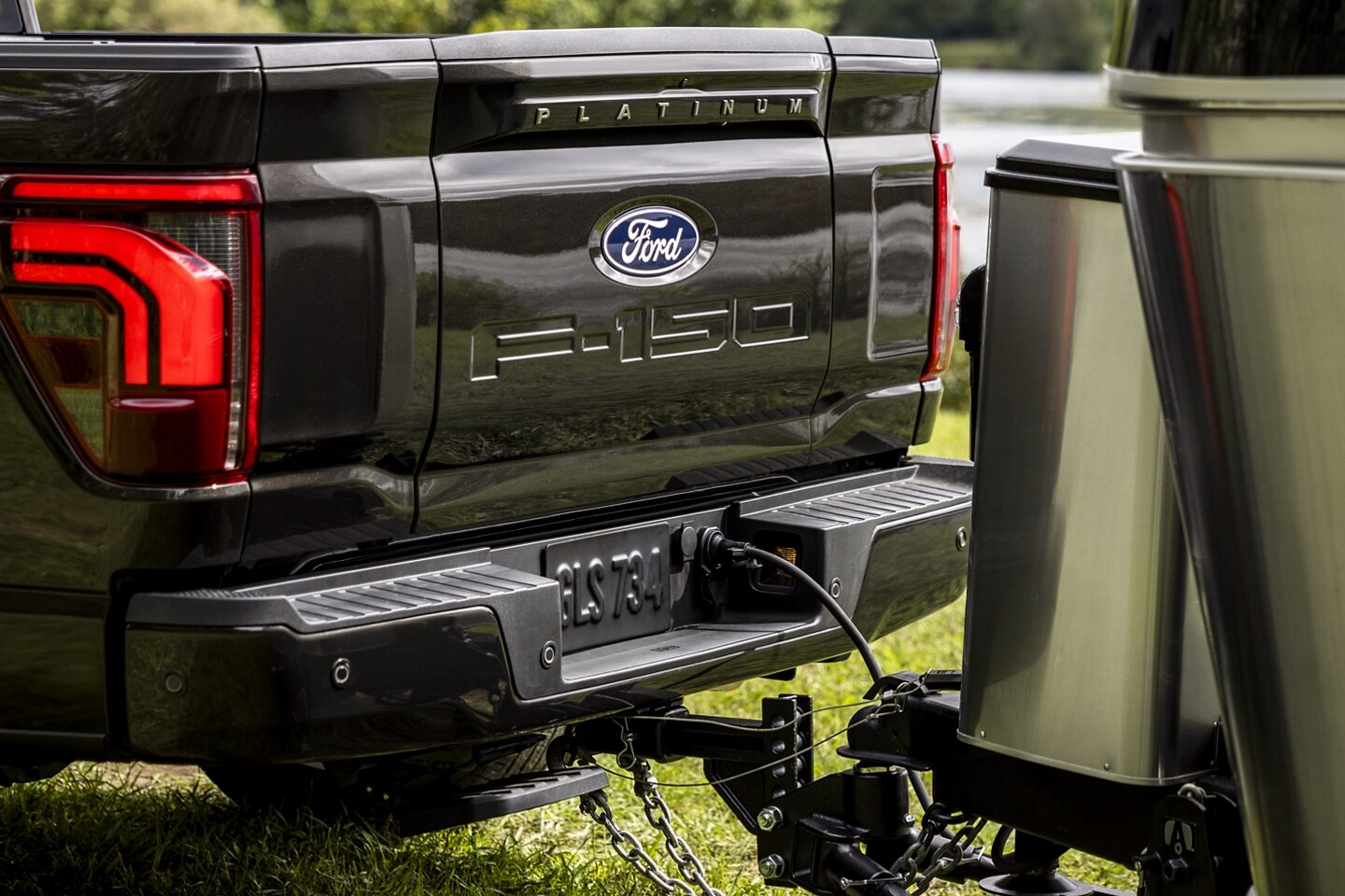  Dynamic hitch assist Ford F-150 pickup truck attached to a camper with electrical hookups 