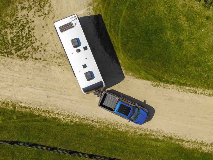Trailer Backup Assist camera displaying a birds eye view of a f-150 backing up a large camper