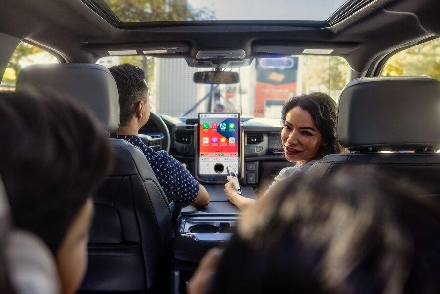 Family of four sitting comfortably in a 2023 Ford F-150 Lightning®