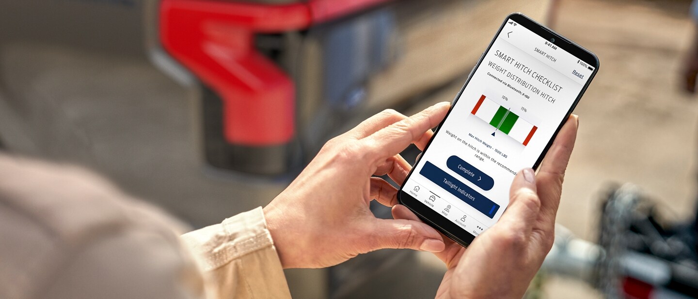 Man looking at his smartphone screen, reviewing information