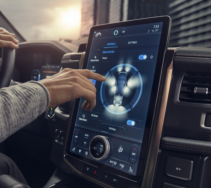 Close-up of driver operating the 15.5-inch touchscreen on 2023 Ford F-150 Lightning