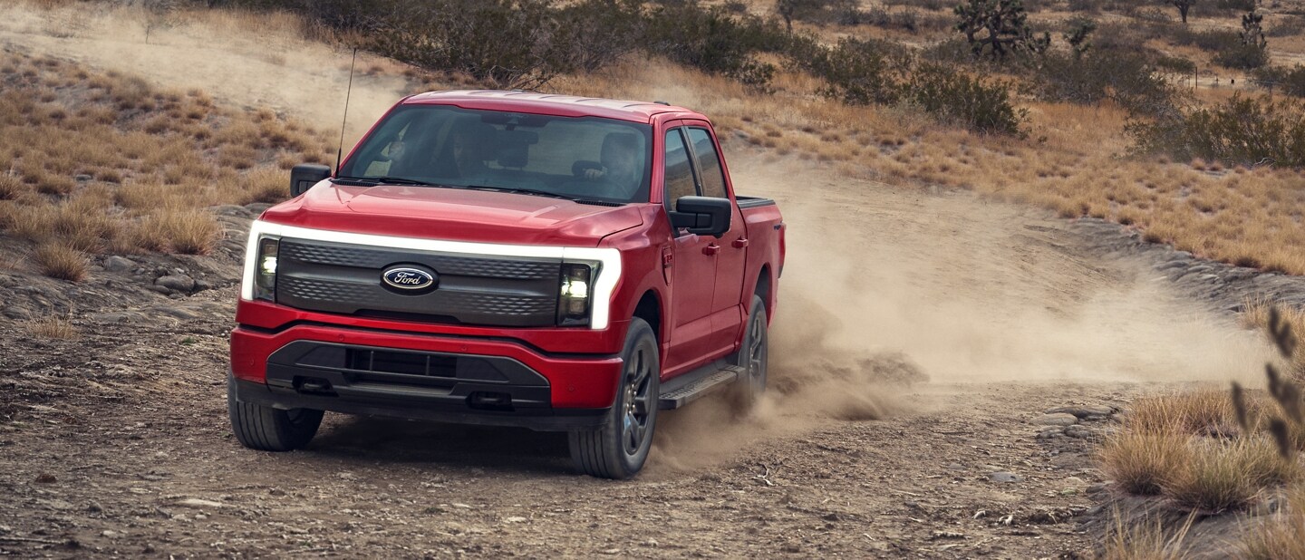 A 2023 Ford F-150 Lightning™ being driven through the desert