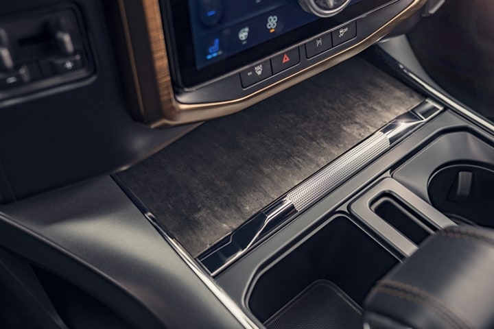 Close-up of center console showing the oak trim accents