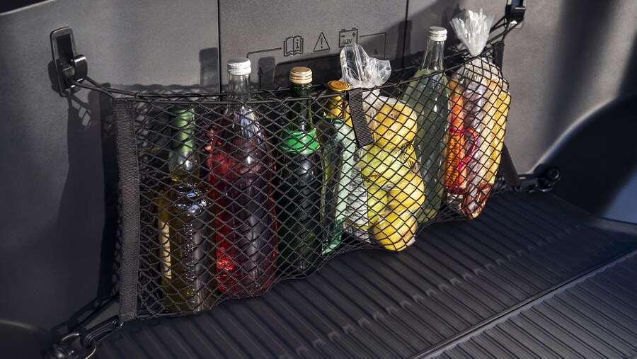Interior of a 2023 Ford F-150 Lightning® with mesh bag holding food and drinks