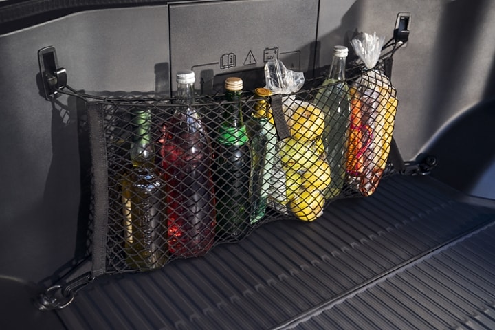 Interior of a 2023 Ford F-150 Lightning® with mesh bag holding food and drinks