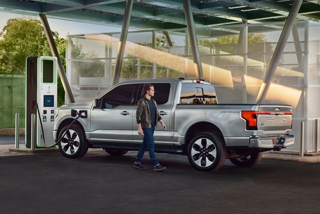 A 2023 Ford F-150 Lightning® getting charged at a public charging station