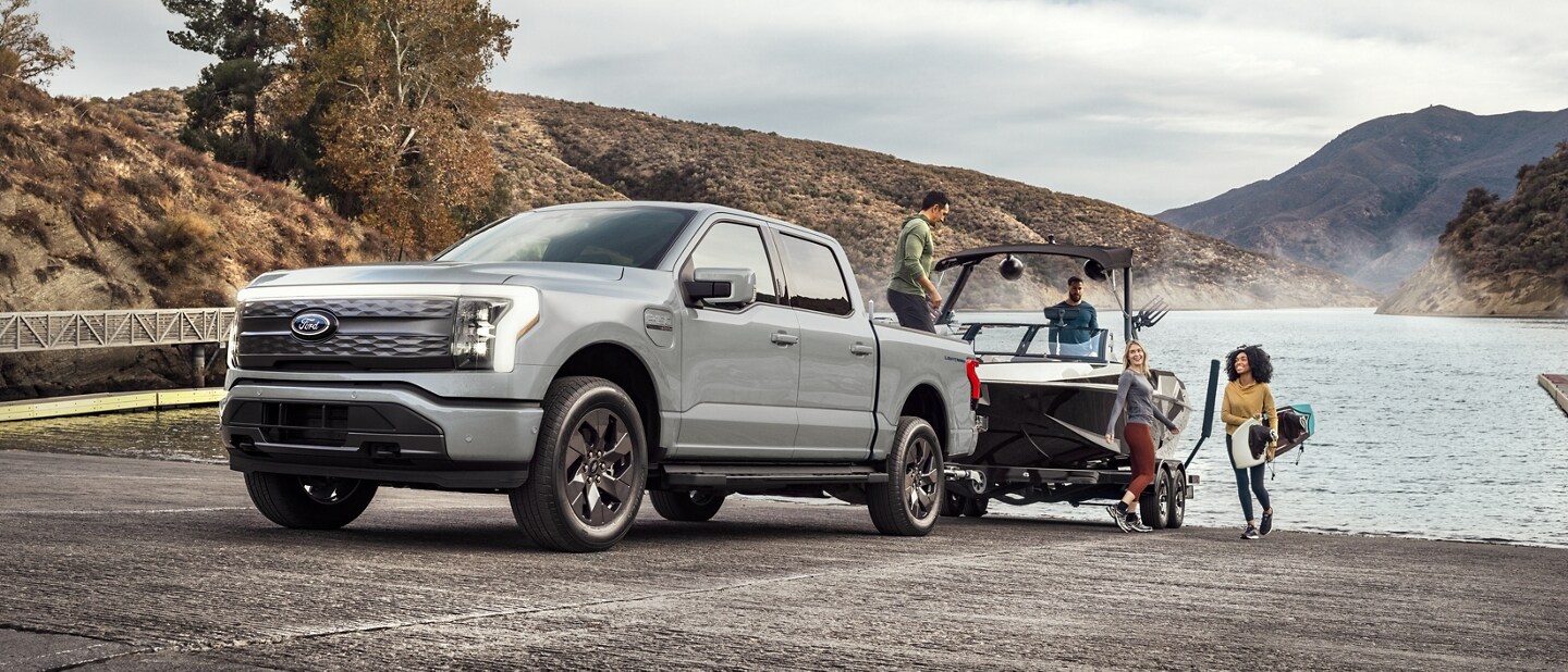 A 2023 Ford F-150 Lightning® towing a boat out of the water