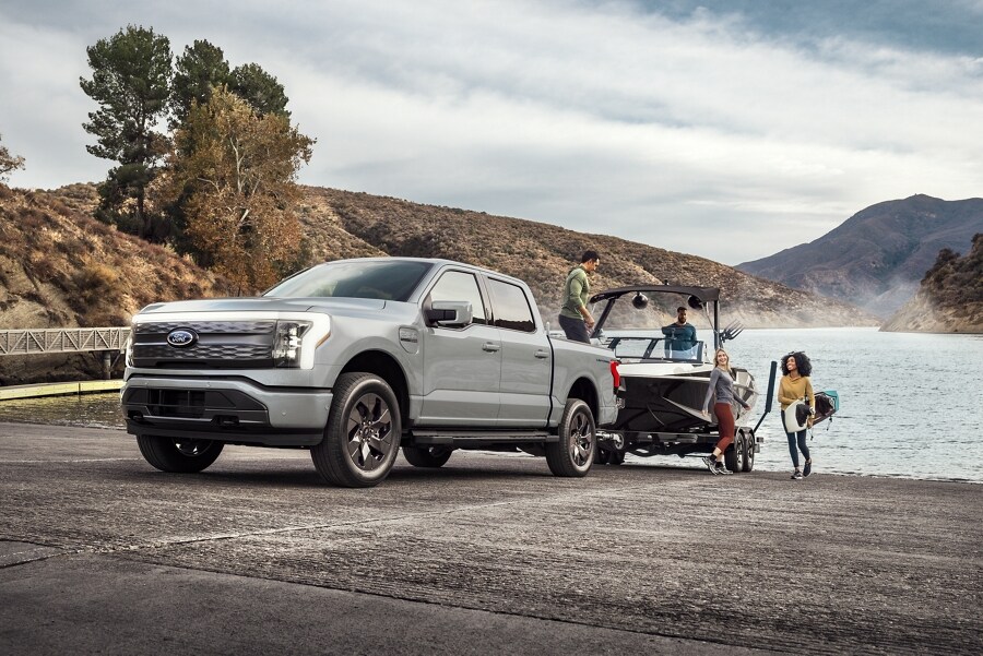 A 2023 Ford F-150 Lightning® towing a boat out of the water