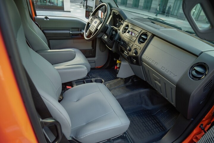 Driver and passenger seats in front interior of 2023 Ford Medium Duty