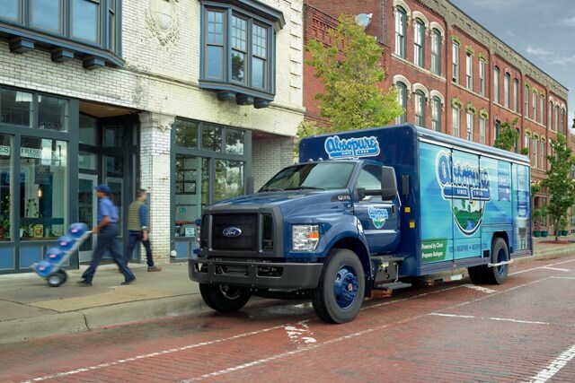 2024 Ford F-750 Regular Cab with beverage truck upfit and custom design on city street