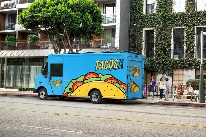 2023 Ford F-59 Stripped Chassis with food truck upfit parked on a busy street