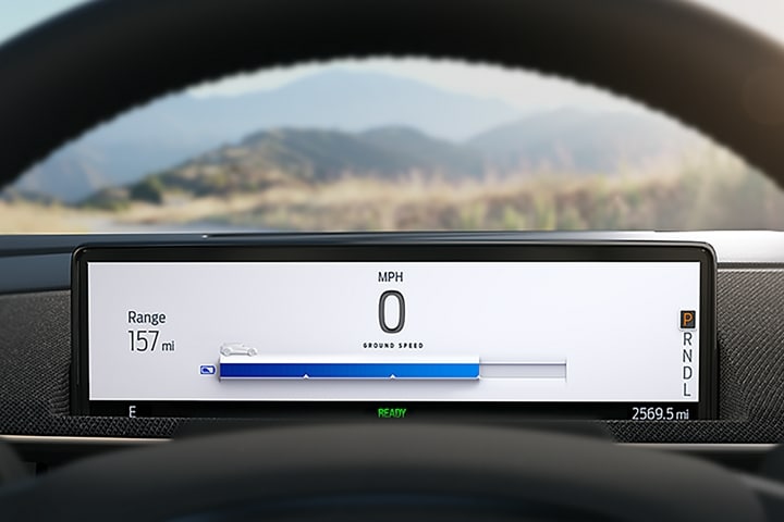 Intelligent Range display behind the wheel of a 2023 Ford Mustang Mach-E® SUV