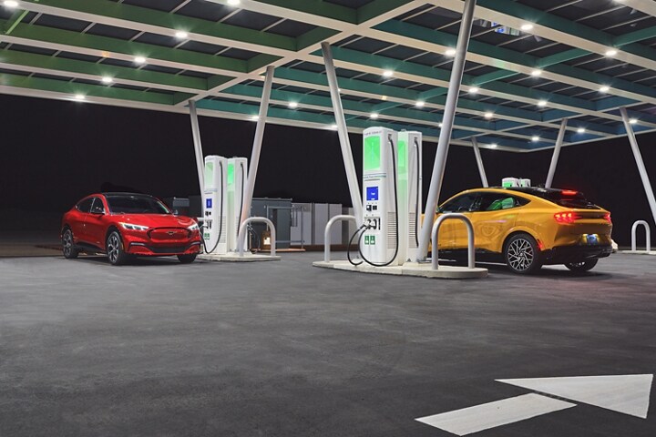 Two 2023 Ford Mustang Mach-E® parked at a charging station