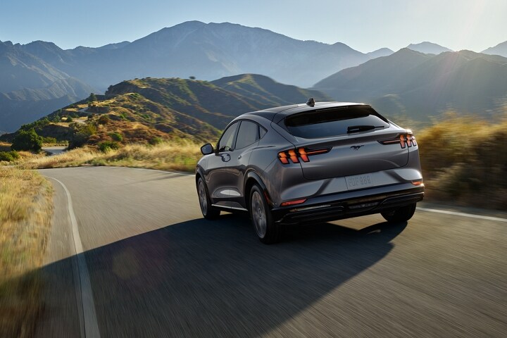 2023 Ford Mustang Mach-E® being driven on a scenic mountain highway