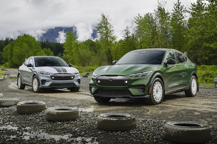 Two 2024 Ford Mustang Mach-E® vehicles parked on a dirt track